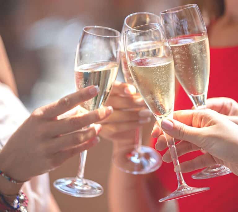 Guests toasting with sparkling wine at a private event on board